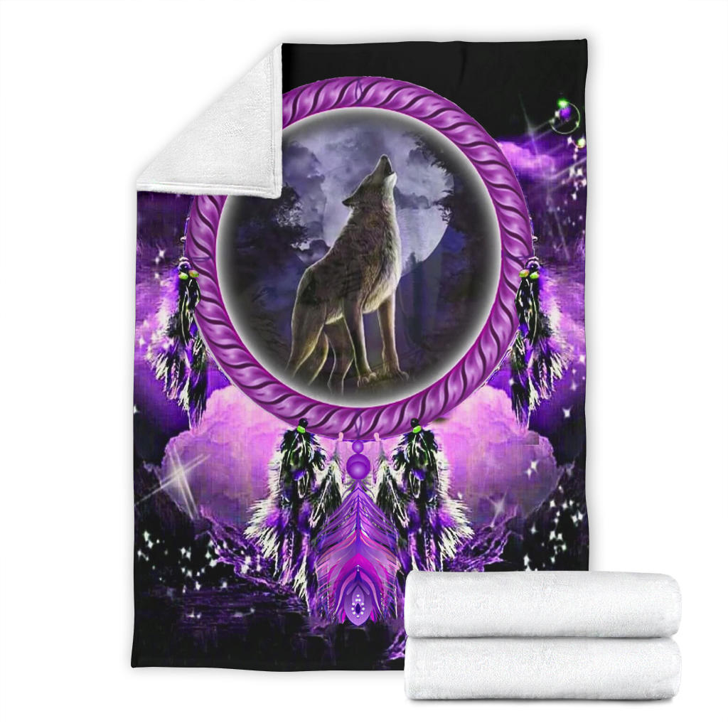 Dream catcher blanket folded with white backing, purple moon wolf and feather motifs