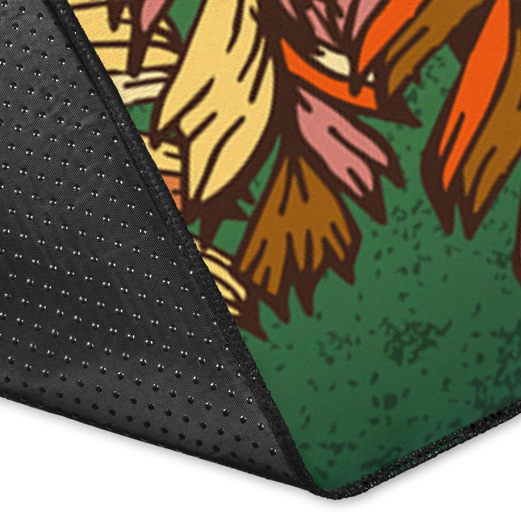 Corner close-up of green horse area rug with black non-slip backing and multicolor feather print