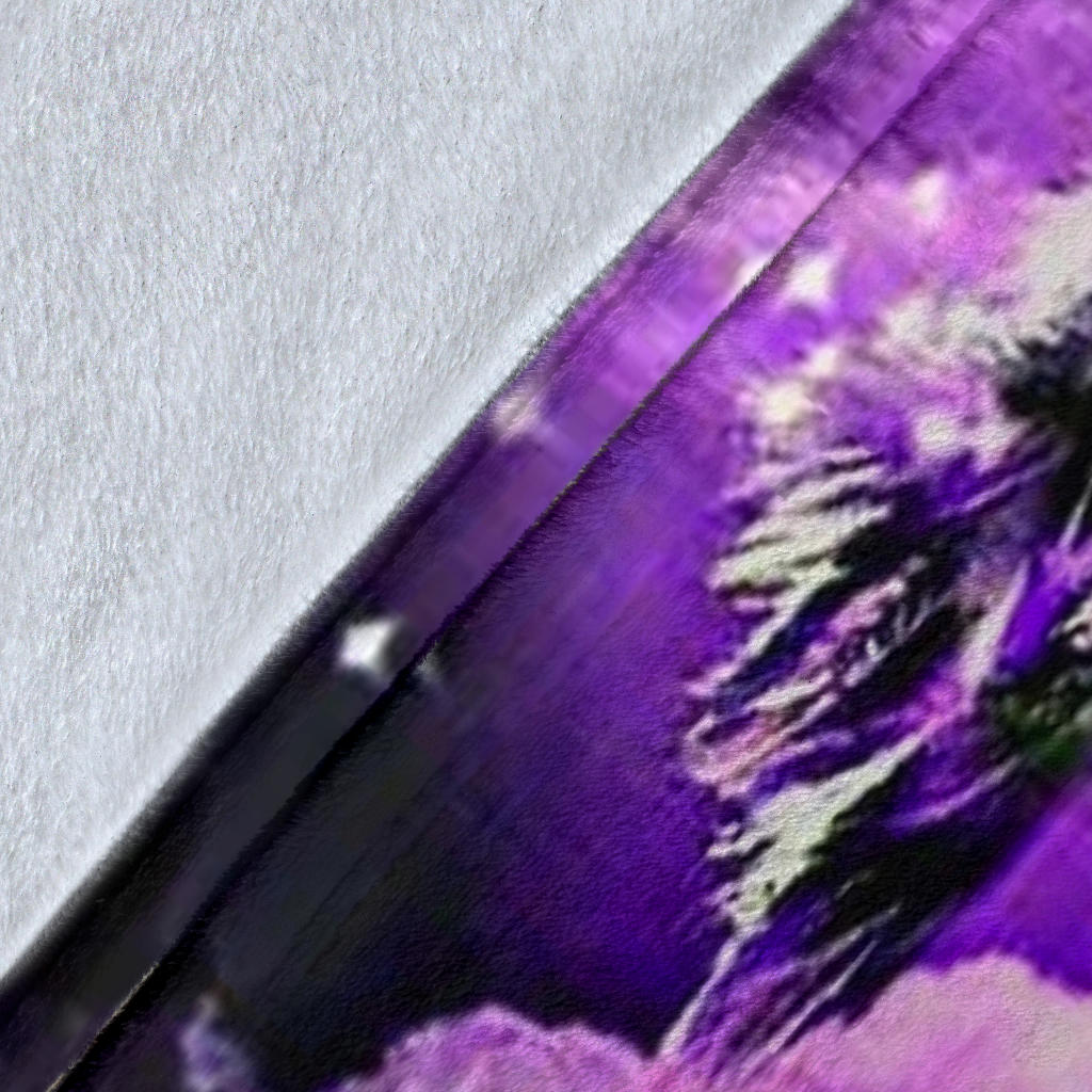 Close-up of purple and black dream catcher blanket print with wolf and star speckles