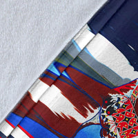 Close-up horse costume blanket fabric, blue/navy print detail with red/white/green stripes