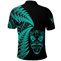 Black polo shirt back view with turquoise fern leaf design and tiki-style face