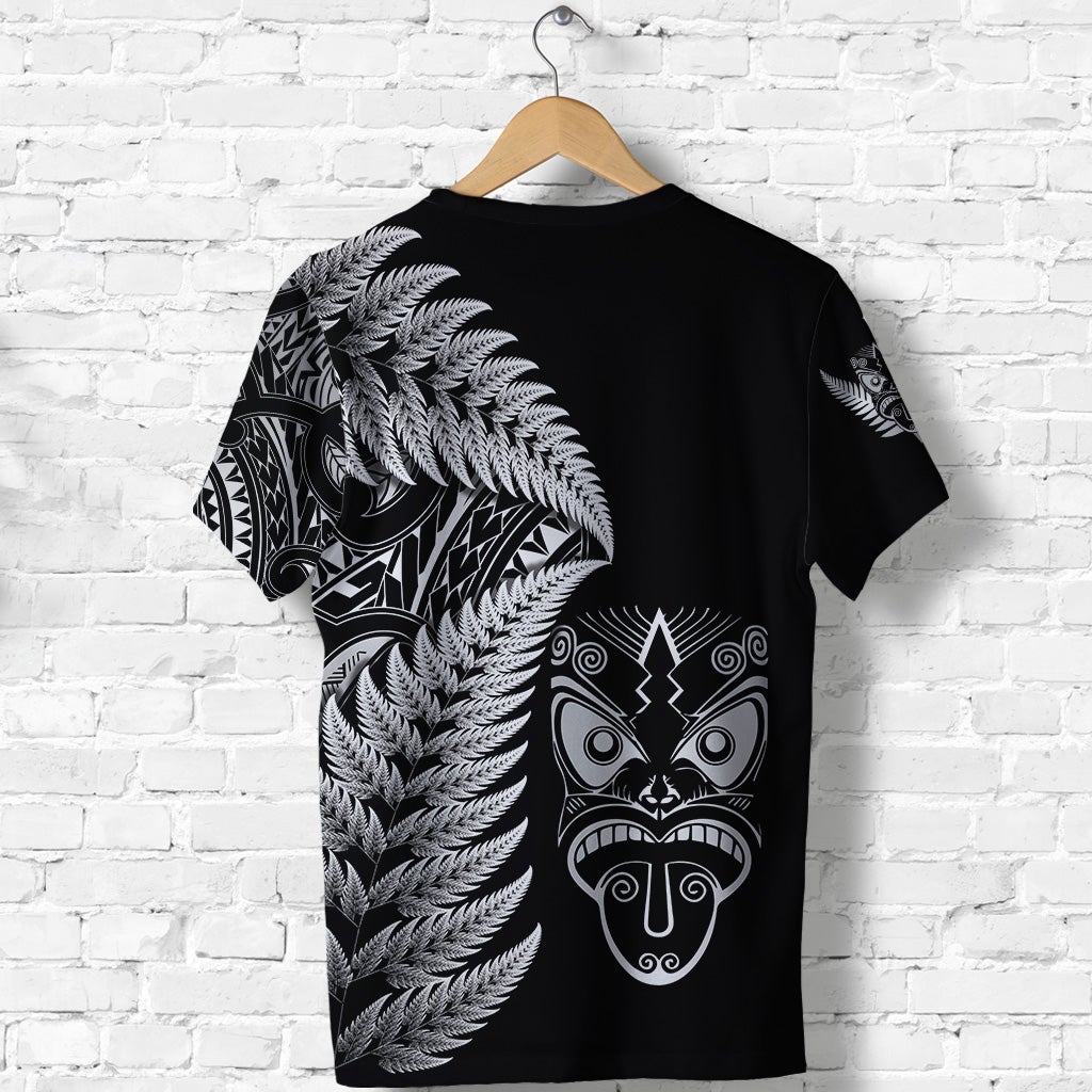 Black T-shirt back print with silver fern feathers and Maori mask design