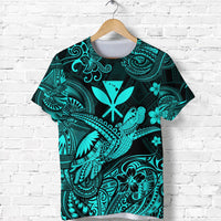 Turquoise and dark patterned T-shirt with Polynesian turtle and floral motifs