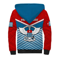 Sherpa hoodie coat with blue hood, back emblem with wings, red sleeves and striped design