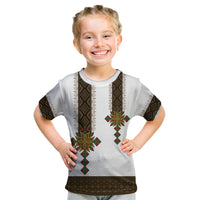 Kids white t-shirt with geometric tile print and colorful sunburst on front