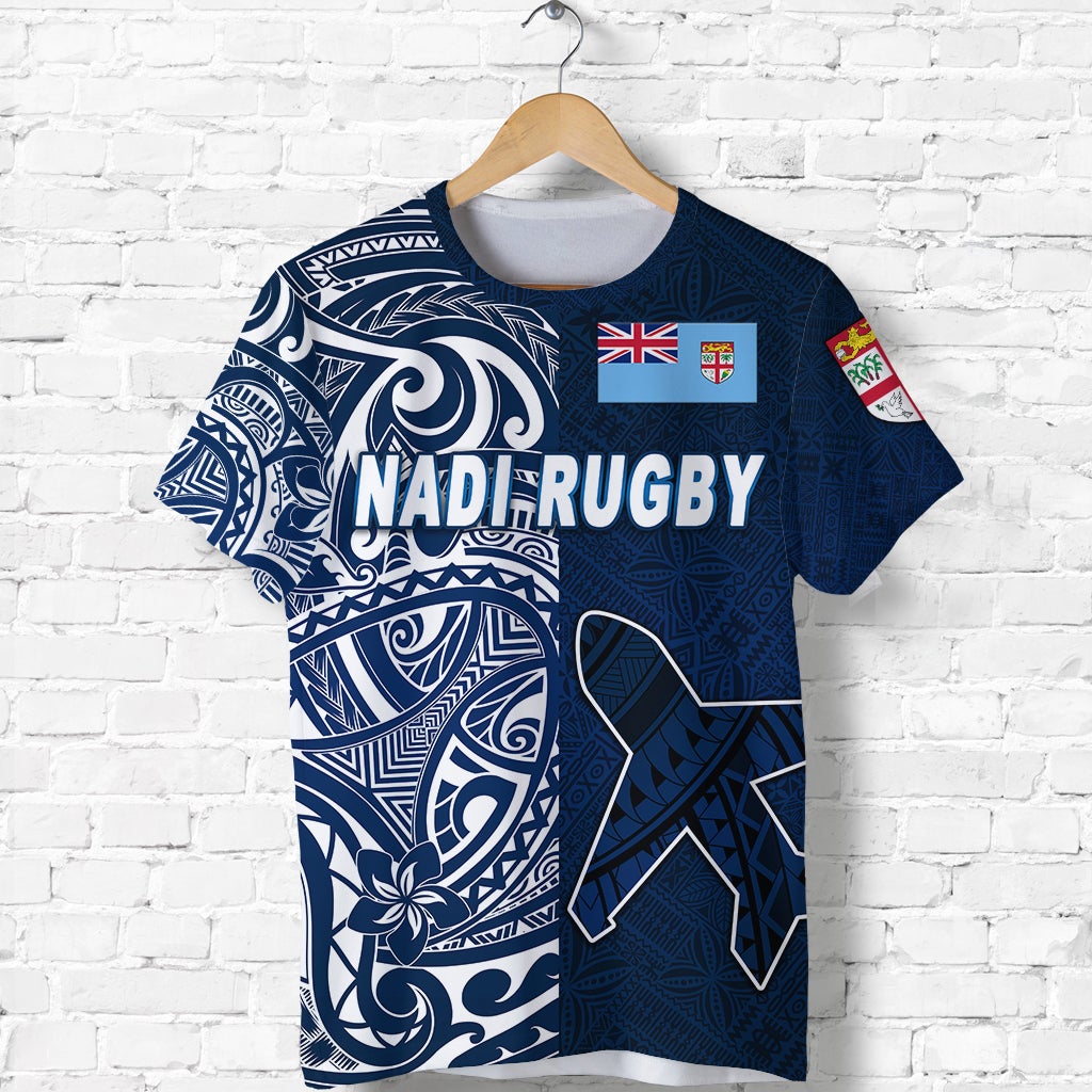 Navy-blue Nadi Rugby T-shirt front: large tribal graphic with flag/crest patches