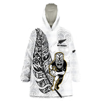 White wearable blanket hoodie with NZ Rugby emblem and Maori warrior print