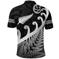 Back view black polo with big white fern frond, swirling Maori motifs, and leaf hem print