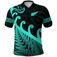 Turquoise and dark polo shirt with Maori-style koru, fern fronds and tribal patterns (front)
