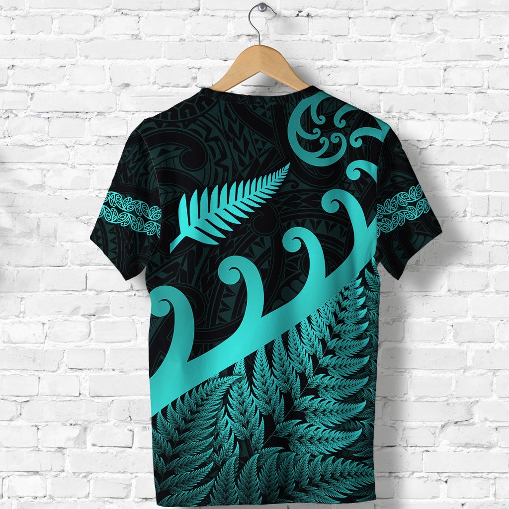 Dark T-shirt with turquoise fern and koru tribal print, short sleeves back view