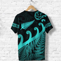 Dark T-shirt with turquoise fern and koru tribal print, short sleeves back view