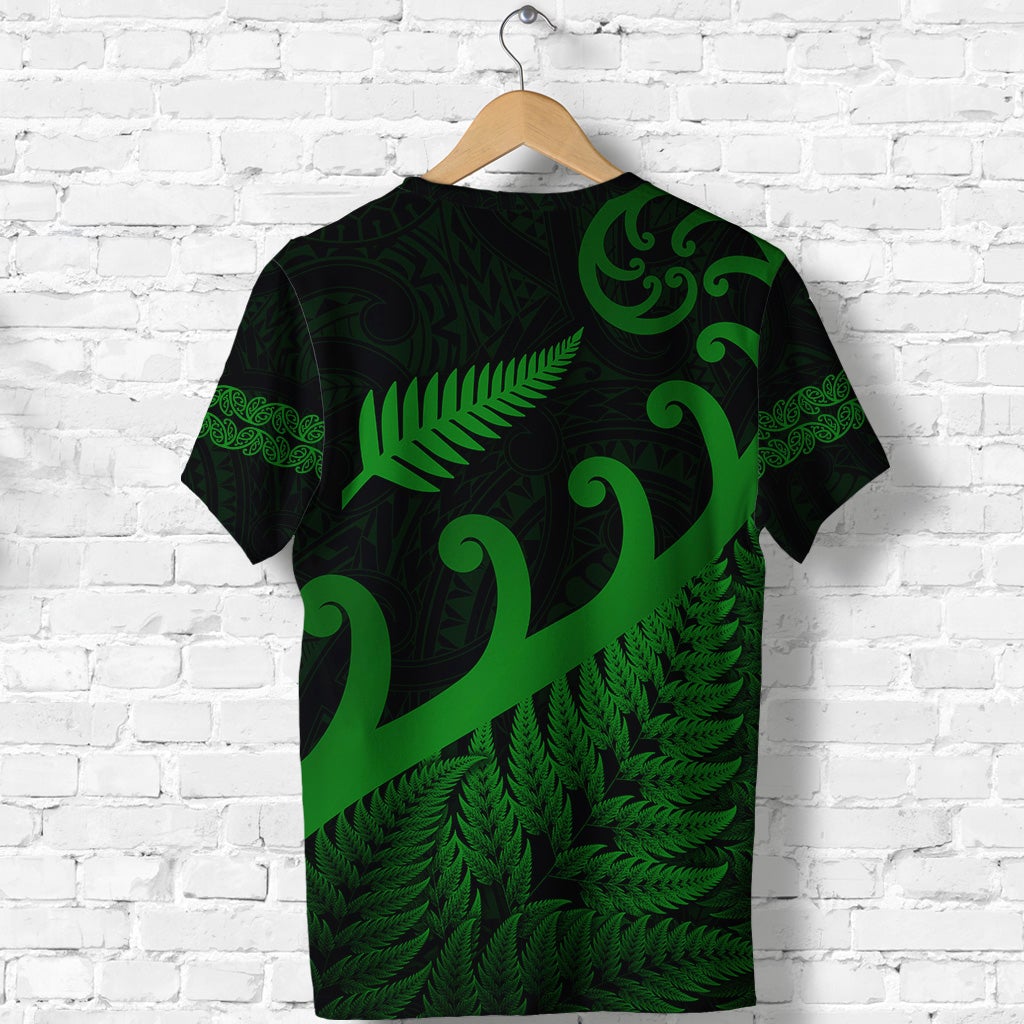 Green Maori-style T-shirt back view with koru and fern leaf pattern across