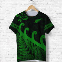 Green Maori-style T-shirt with large koru and fern leaf graphic on front