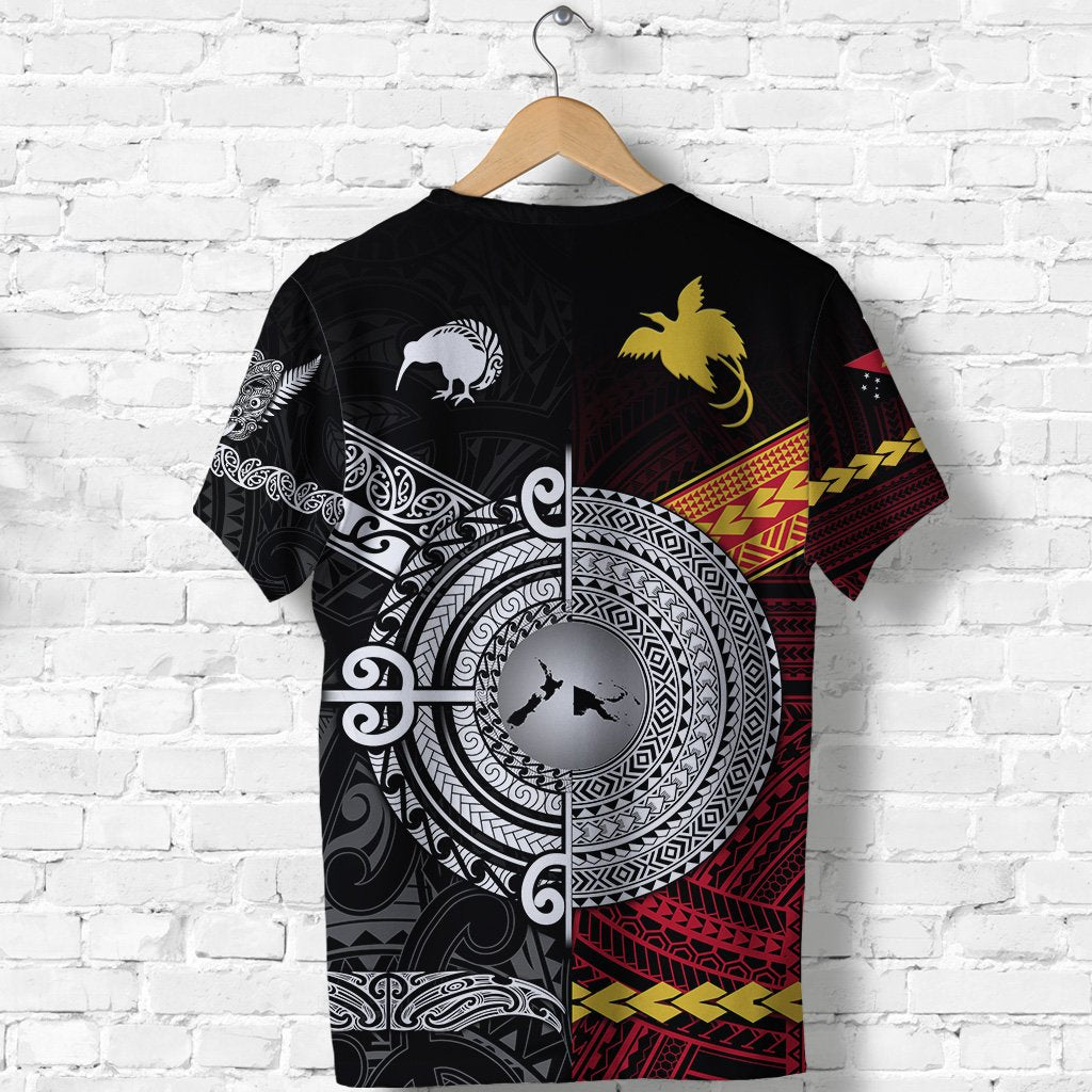 Black tee with large circular tribal emblem, fern and bird silhouettes, red band