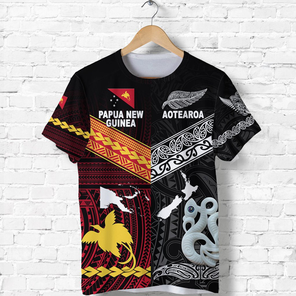 Black tee with Papua New Guinea and Aotearoa text panels, bird and wave prints, red