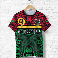 Green Vanuatu warrior T-shirt with tribal face emblem and leafy pattern