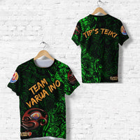 Green short-sleeve T-shirt with tribal graphics and front text “TEAM VARU INO”.