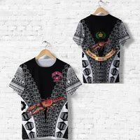 Black tapa-style rugby t-shirt with patterned sleeves and crab graphic on front