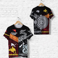 Black tee with tribal graphics, kiwi and lizard motifs, red/yellow accents