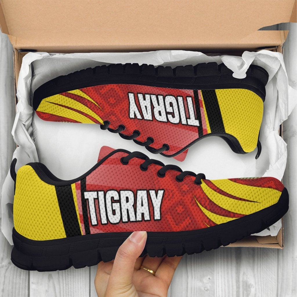 Tigray sneakers in box, red/yellow star and coat-of-arms design, black sole