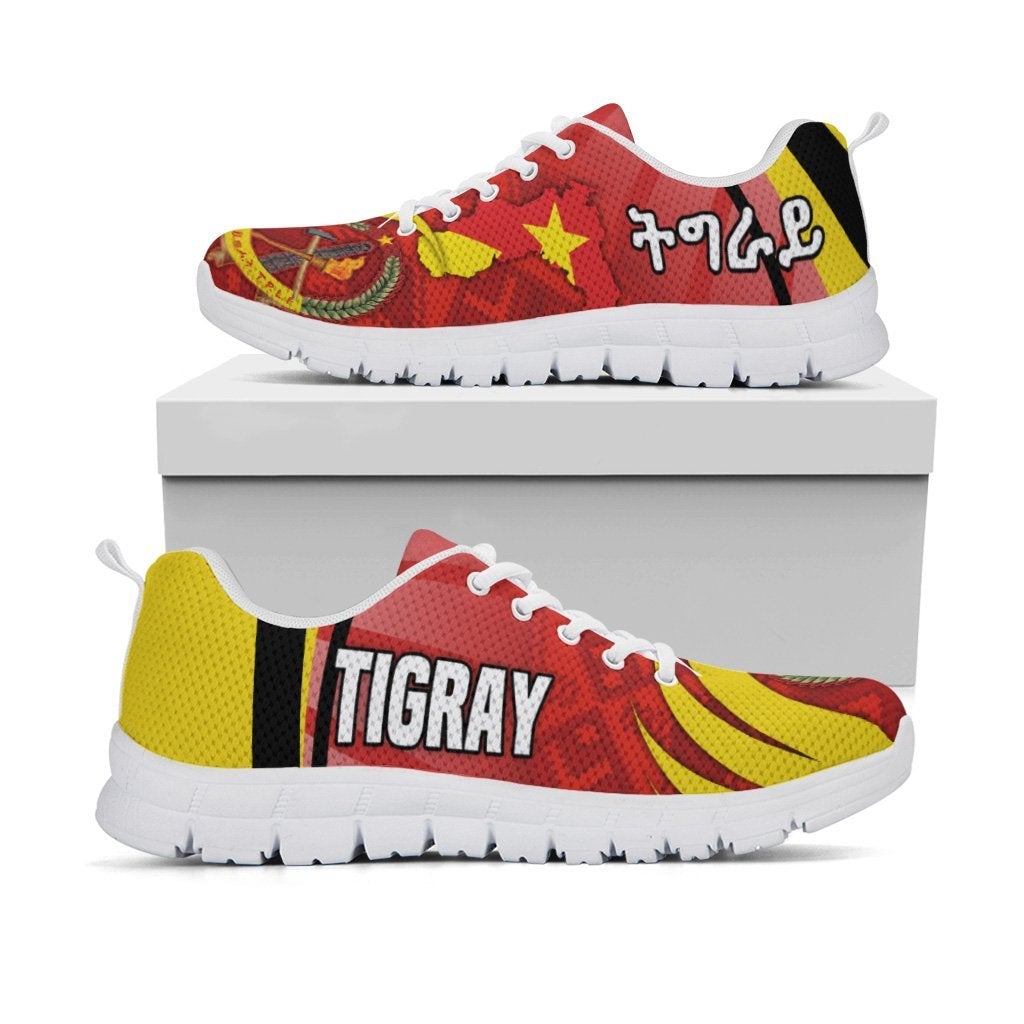 Tigray sneakers, red/yellow Africa pattern with stars and coat-of-arms, white sole view