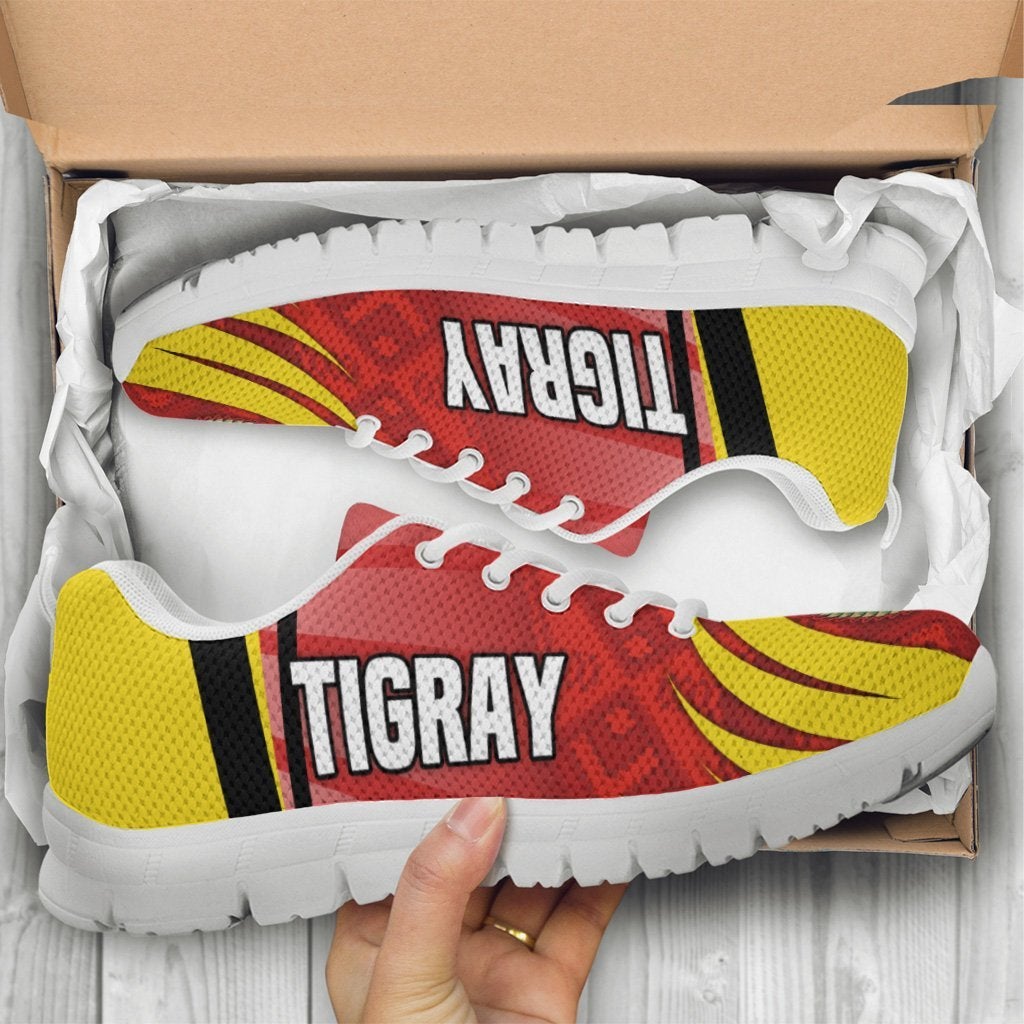Tigray sneakers in box, red/yellow star and coat-of-arms design, white sole