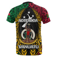 Back graphic T-shirt with Aoteāroa text, person emblem, and Vanuatu in green/red