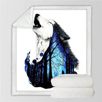 Folded blanket with white wolf face and blue night forest artwork, cream back