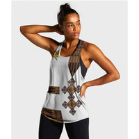 White women's racerback tank with geometric Ethiopian print and gold lion design