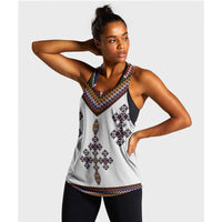 Women’s racerback tank in white with colorful Ethiopian-style zigzag print, front view